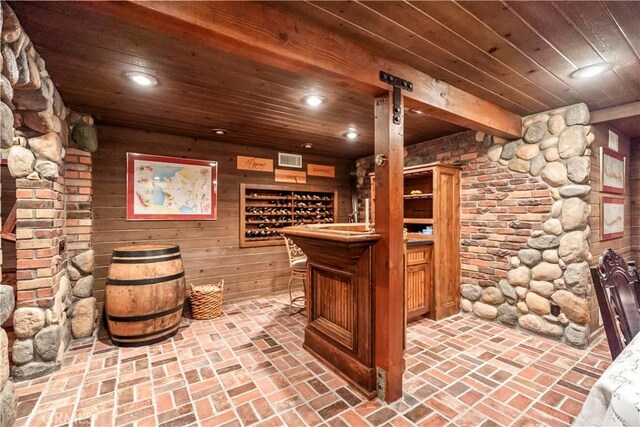 7008 Hawarden Dr, Riverside, CA 92506 - wine area featuring wooden ceiling, recessed lighting, brick flooring, and wooden walls