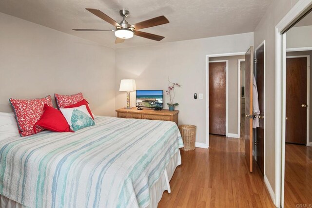1855 Rubenstein Dr, Cardiff By The Sea, CA 92007 - bedroom with light wood-style flooring, baseboards, and a ceiling fan