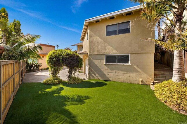 1855 Rubenstein Dr, Cardiff By The Sea, CA 92007 - back of property with stucco siding and a patio area