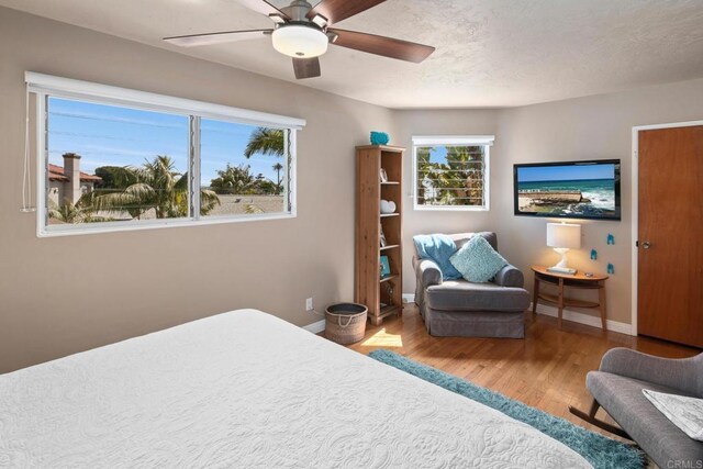1855 Rubenstein Dr, Cardiff By The Sea, CA 92007 - bedroom with wood finished floors, baseboards, and ceiling fan