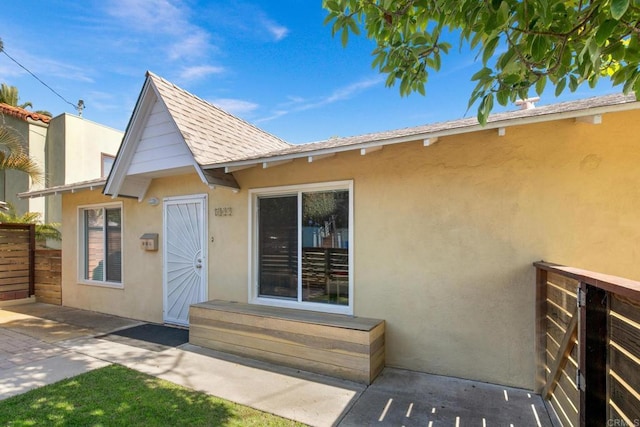 1855 Rubenstein Dr, Cardiff By The Sea, CA 92007 - view of front of home with stucco siding and fence
