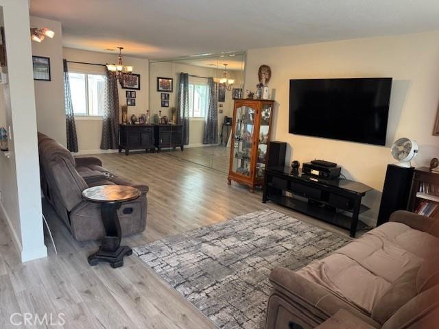 13278 Parkland Cir, Sylmar, CA 91342 - living area with a chandelier, wood finished floors, and plenty of natural light