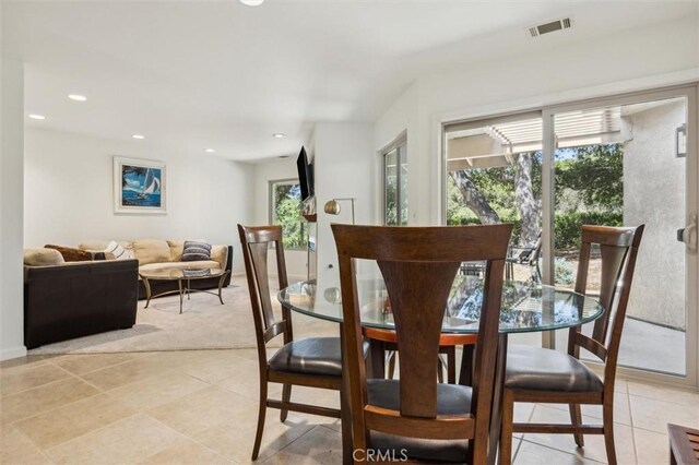 1334 Tourney Hill Ln Unit 61, Nipomo, CA 93444 - dining area with light tile patterned floors, recessed lighting, and light colored carpet