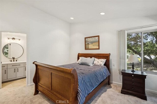 1334 Tourney Hill Ln Unit 61, Nipomo, CA 93444 - bedroom featuring light carpet, baseboards, recessed lighting, a sink, and connected bathroom