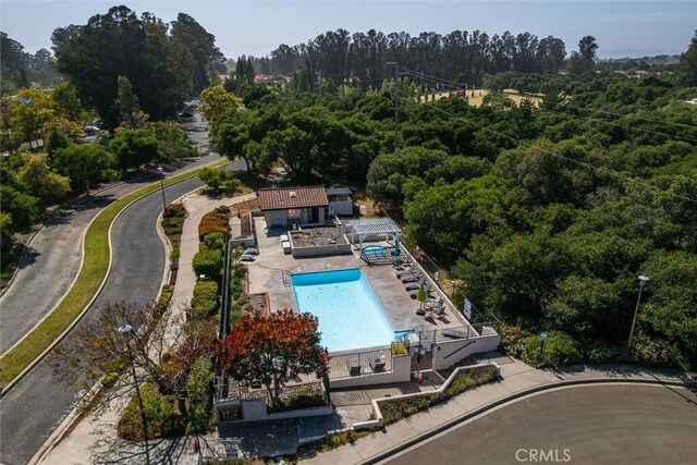 1334 Tourney Hill Ln Unit 61, Nipomo, CA 93444 - bird's eye view of a pool area and a heavily wooded area
