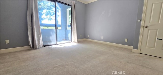 623 Church Pl Unit 3, Redlands, CA 92374 - spare room with healthy amount of natural light, carpet floors, and baseboards