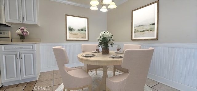 623 Church Pl Unit 3, Redlands, CA 92374 - dining room featuring a chandelier, light tile patterned floors, a wainscoted wall, and ornamental molding