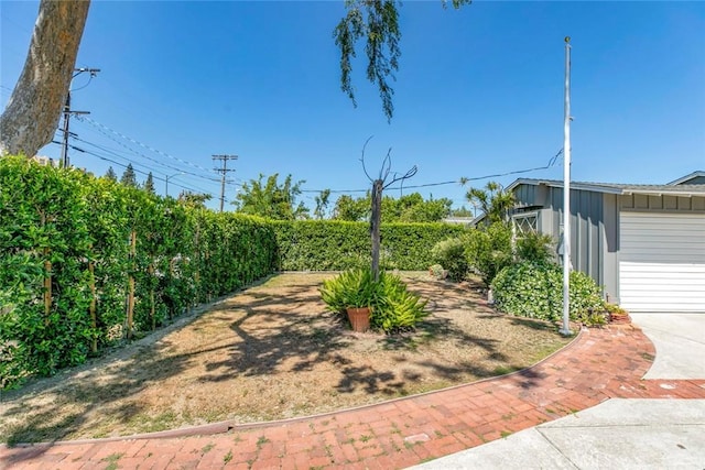 14719 Wyandotte St, Van Nuys, CA 91405 - view of yard with a garage