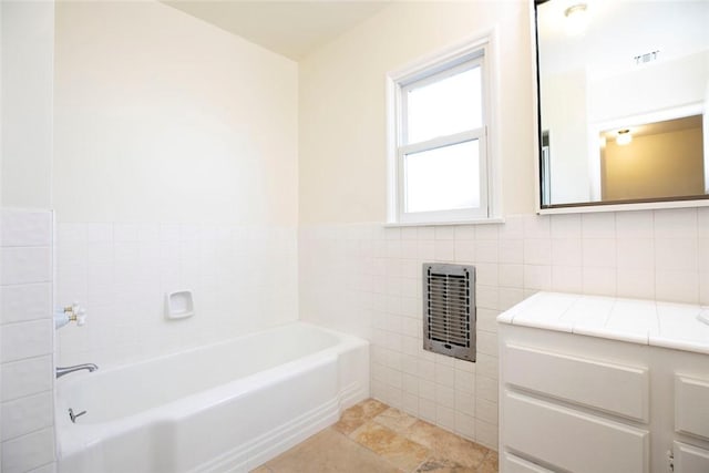 14719 Wyandotte St, Van Nuys, CA 91405 - full bathroom with a bath, tile walls, and vanity