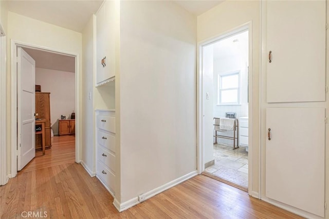 14719 Wyandotte St, Van Nuys, CA 91405 - hallway with light wood-type flooring and baseboards