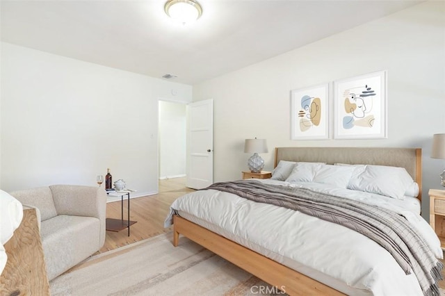 14719 Wyandotte St, Van Nuys, CA 91405 - bedroom with light wood-type flooring and baseboards