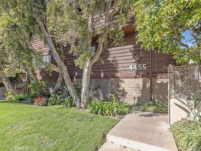 4455 Fulton Ave Unit 2, Sherman Oaks, CA 91423 - view of home's exterior featuring a lawn