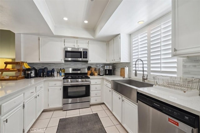 4455 Fulton Ave Unit 2, Sherman Oaks, CA 91423 - kitchen featuring stainless steel appliances, a sink, a tray ceiling, white cabinetry, and recessed lighting