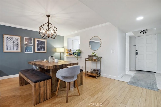 4455 Fulton Ave Unit 2, Sherman Oaks, CA 91423 - dining area with baseboards, light wood-style floors, a chandelier, and crown molding