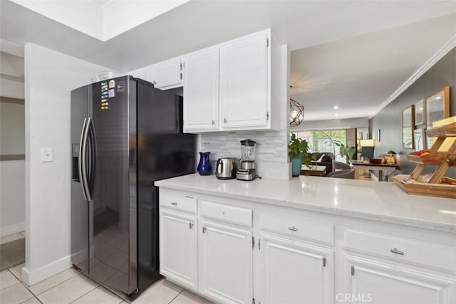 4455 Fulton Ave Unit 2, Sherman Oaks, CA 91423 - kitchen with refrigerator with ice dispenser, white cabinetry, light tile patterned floors, ornamental molding, and tasteful backsplash