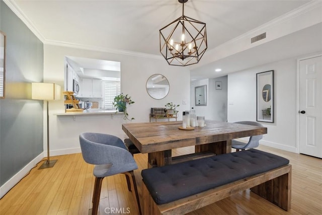 4455 Fulton Ave Unit 2, Sherman Oaks, CA 91423 - dining space with ornamental molding, light wood-style floors, baseboards, and a chandelier