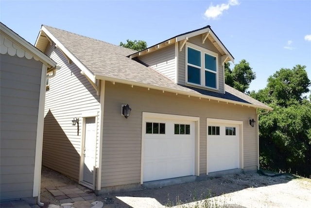 5 W 12th St, Paso Robles, CA 93446 - view of home's exterior with a garage and a shingled roof