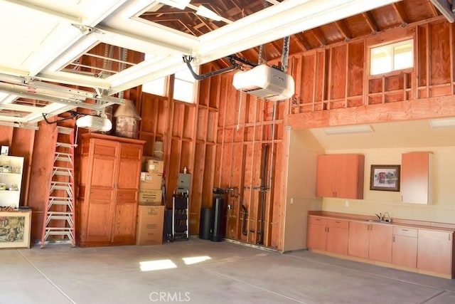 5 W 12th St, Paso Robles, CA 93446 - garage featuring a garage door opener and a sink