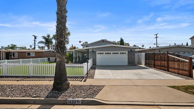 1420 E Ln, Imperial Beach, CA 91932 - view of front of property featuring driveway, an attached garage, and a fenced front yard