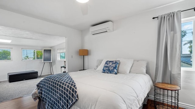 1420 E Ln, Imperial Beach, CA 91932 - bedroom with an AC wall unit, wood finished floors, and ceiling fan