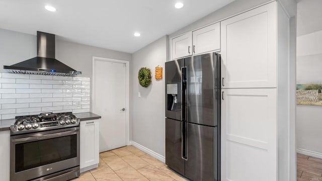 1420 E Ln, Imperial Beach, CA 91932 - kitchen featuring stainless steel appliances, wall chimney range hood, tasteful backsplash, white cabinets, and recessed lighting