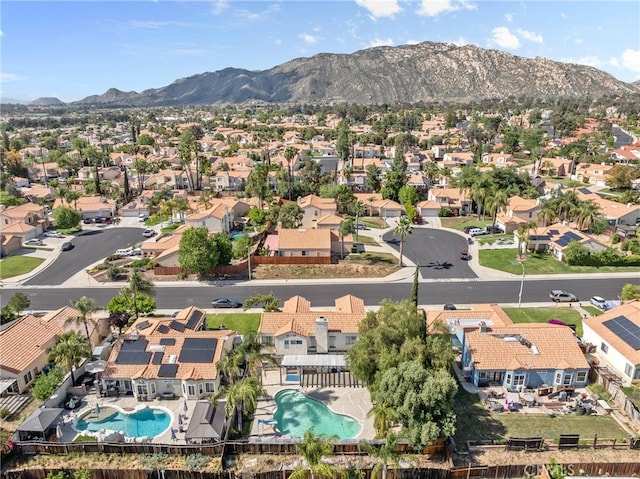 23633 Breezy Meadow Ct, Moreno Valley, CA 92557 - aerial perspective of suburban area featuring a pool and a mountainous background