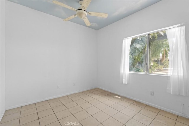 23633 Breezy Meadow Ct, Moreno Valley, CA 92557 - empty room with a ceiling fan, light tile patterned floors, and baseboards