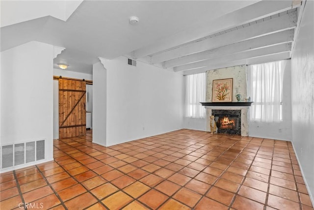 23633 Breezy Meadow Ct, Moreno Valley, CA 92557 - unfurnished living room with a lit fireplace, tile patterned floors, and a barn door