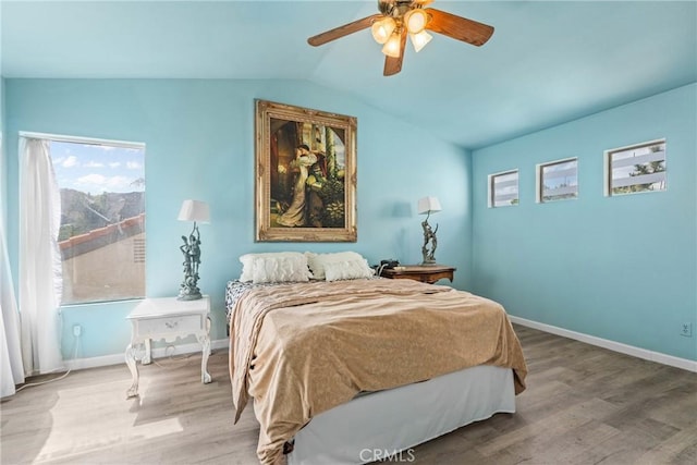 23633 Breezy Meadow Ct, Moreno Valley, CA 92557 - bedroom featuring wood finished floors, lofted ceiling, and multiple windows