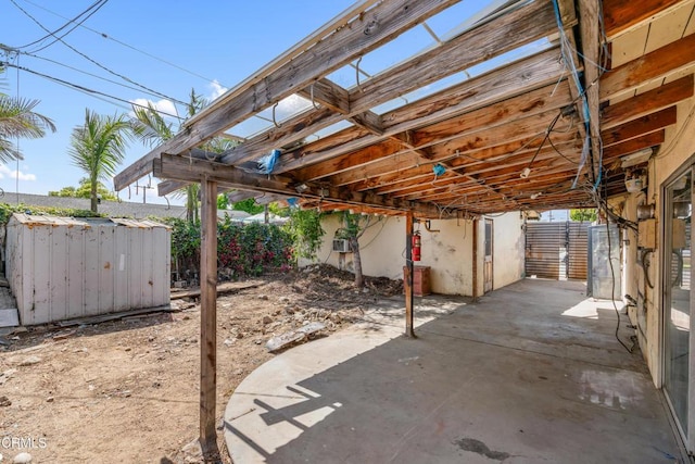 8731 Lucia Pl, Sun Valley, CA 91352 - view of patio with a shed, an outdoor structure, and fence