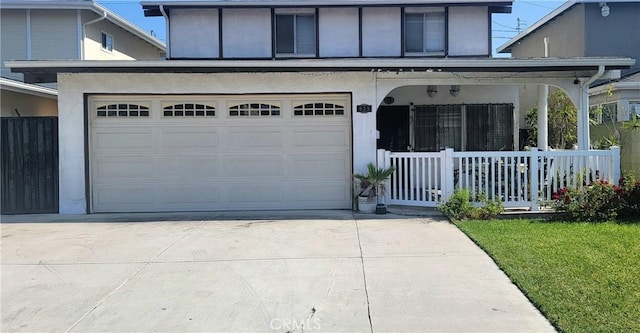 838 E Calbas St, Carson, CA 90745 - view of front of property with covered porch, driveway, stucco siding, and a front yard