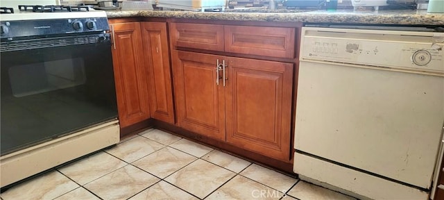 838 E Calbas St, Carson, CA 90745 - kitchen view of black gas stove, dishwasher, and brown cabinetry