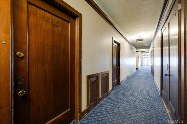 315 W 3rd St Unit 1003, Long Beach, CA 90802 - hallway with dark colored carpet, crown molding, and baseboards