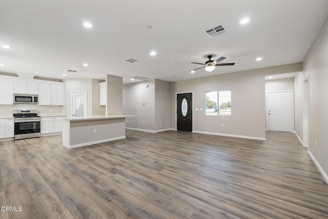 40719 E 171st St E, Lake Los Angeles, CA 93535 - unfurnished living room with recessed lighting, a ceiling fan, baseboards, and wood finished floors