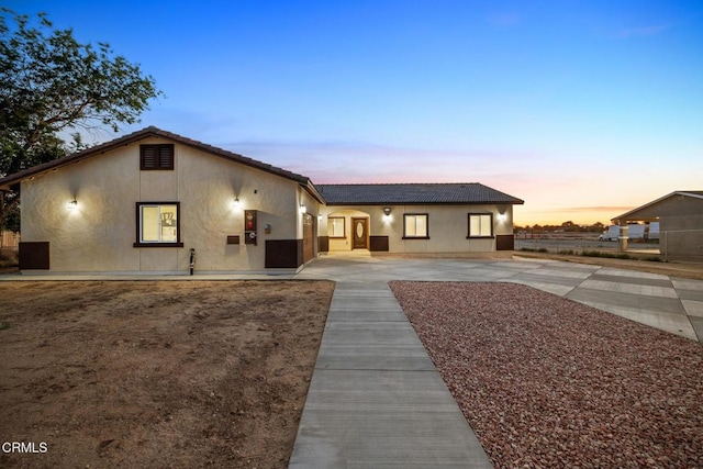 40719 E 171st St E, Lake Los Angeles, CA 93535 - view of front of home with concrete driveway, stucco siding, and a tile roof