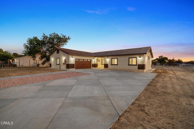 40719 E 171st St E, Lake Los Angeles, CA 93535 - single story home featuring driveway, an attached garage, stucco siding, a tile roof, and fence