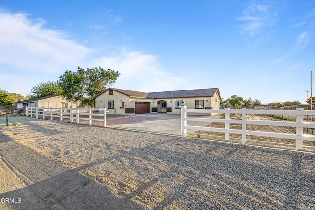40719 E 171st St E, Lake Los Angeles, CA 93535 - ranch-style home with driveway, a garage, and stucco siding