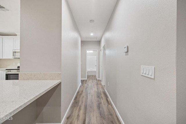 40719 E 171st St E, Lake Los Angeles, CA 93535 - corridor featuring light wood-style flooring, baseboards, and recessed lighting