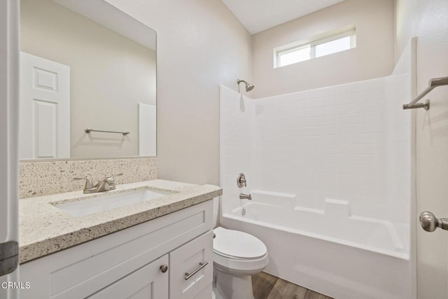 40719 E 171st St E, Lake Los Angeles, CA 93535 - bathroom with toilet, tub / shower combination, wood finished floors, and vanity