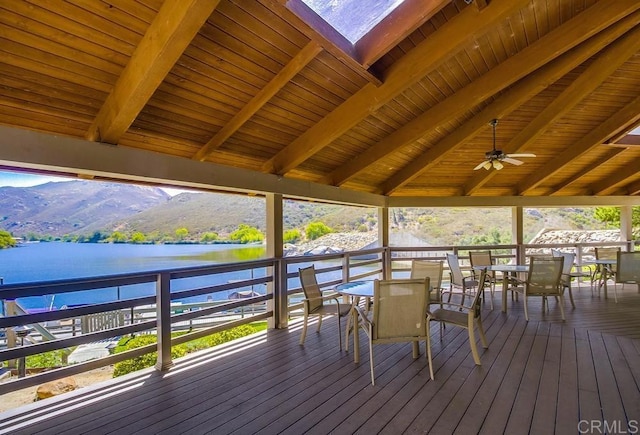 2444 Via Dieguenos, Alpine, CA 91901 - wooden deck with outdoor dining space, a water and mountain view, and a ceiling fan