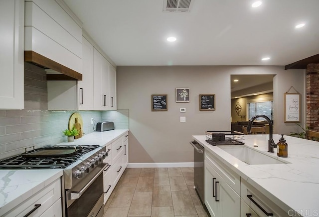 2444 Via Dieguenos, Alpine, CA 91901 - kitchen featuring stainless steel appliances, a sink, baseboards, decorative backsplash, and light stone countertops