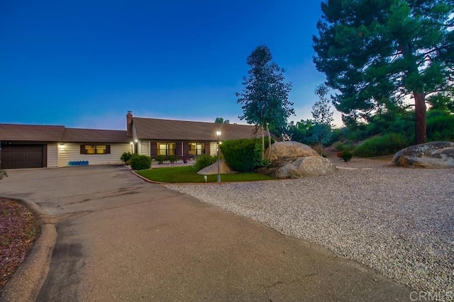 2444 Via Dieguenos, Alpine, CA 91901 - view of front facade featuring driveway, a chimney, and an attached garage
