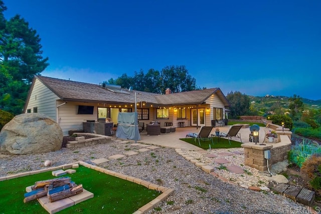 2444 Via Dieguenos, Alpine, CA 91901 - rear view of property with a patio, a chimney, an outdoor kitchen, and an outdoor hangout area