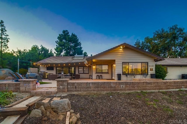 2444 Via Dieguenos, Alpine, CA 91901 - back of property at dusk with a patio and central AC unit