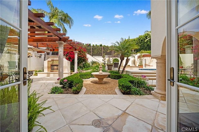 1502 Paseo La Cresta, Palos Verdes Estates, CA 90274 - view of patio / terrace with a pergola and a lit fireplace