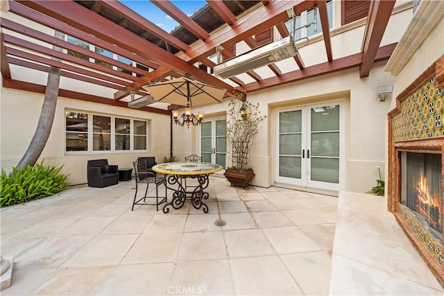 1502 Paseo La Cresta, Palos Verdes Estates, CA 90274 - view of patio / terrace with a warm lit fireplace, a pergola, and french doors