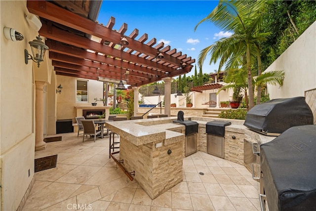 1502 Paseo La Cresta, Palos Verdes Estates, CA 90274 - view of patio with exterior bar, a lit fireplace, and a pergola