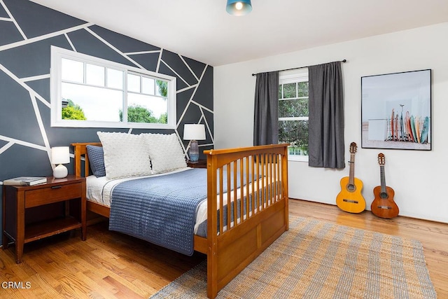 bedroom with wood finished floors