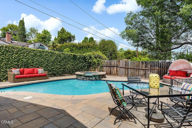 view of pool featuring a patio area, a fenced backyard, an outdoor hangout area, and a pool with connected hot tub