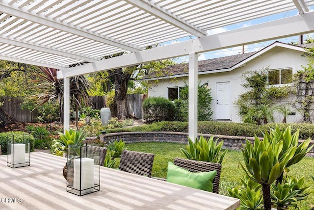view of patio featuring a pergola and outdoor dining space